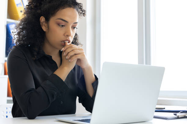 istock Businesswoman looking at computer with worry 2179697095
