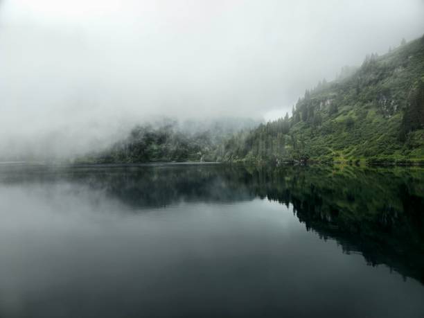Misty lake in the swiss alps captured during summer season at an altitude of 1700m in the canton of glarus.