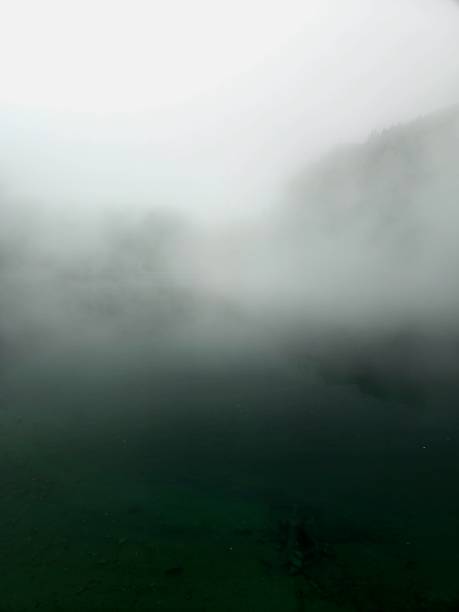 Misty lake in the swiss alps captured during summer season at an altitude of 1700m in the canton of glarus.