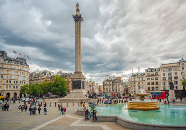 London, UK - September 9 2015: Trafalgar Square with Nelson's Column looking south towards Whitehall on a cloudy day.
