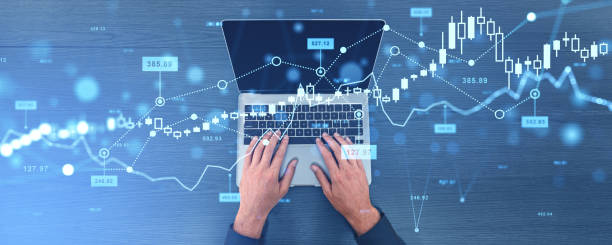 istock Businessman typing on computer, business forex chart and growing lines 2179701038
