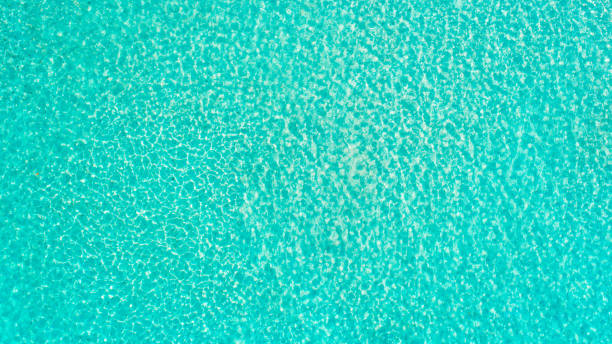 istock Turquoise sea wave ripple curl water surface texture. Summer holiday relax background with copy space. 2179701065