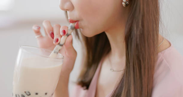 istock woman drink bubble tea home 2179701109