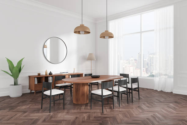 istock White home living room interior with eating table and chairs, drawer and window 2179701618