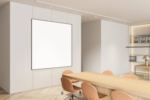 istock Modern office interior with blank poster on wall and wooden table. 3D Rendering 2179702136