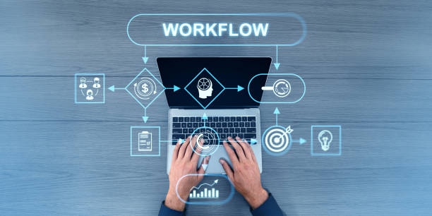 istock Top view of man typing on laptop, flowchart with work process icons and arrows 2179702180