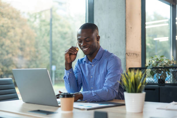 istock Happy young african male customer support executive working in office. 2179709365
