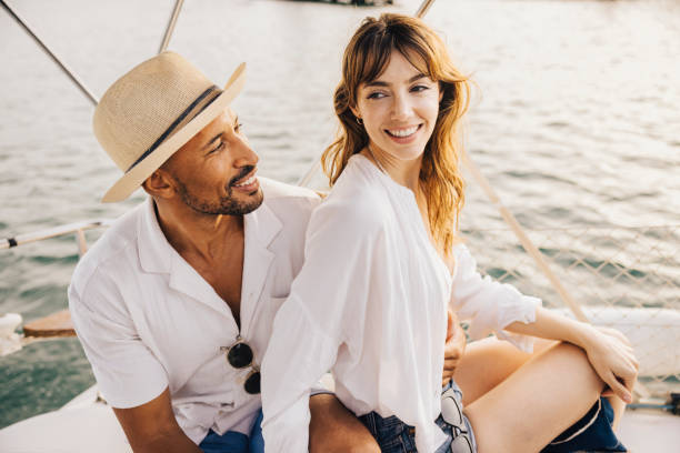 istock Happy couple enjoying a romantic boat trip at sunset 2179710375
