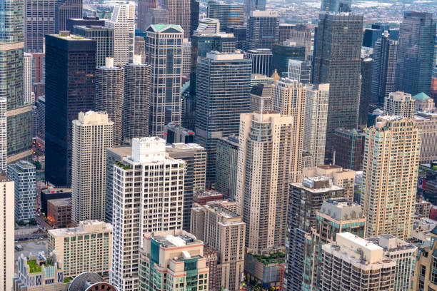 Looking up at skyscrapers in downtown Chicago with clear skies