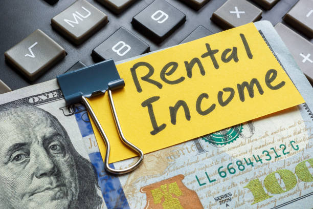 istock Stack of money with label rental income. 2179715126
