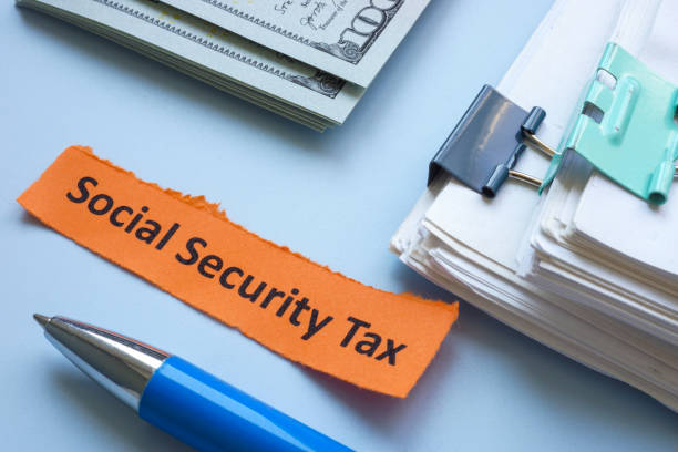 istock A stack of papers with the label social security tax. 2179715690
