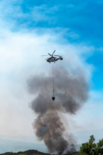 istock Helicopter in action against the flames 2179718196