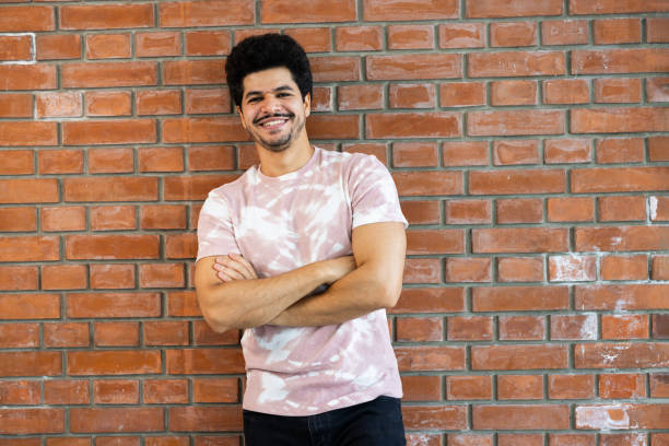 istock Portrait of a young Middle Eastern man leaning on the wall and posing 2179719450
