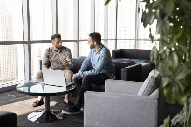istock Two young entrepreneurs men meeting in co-working space 2179720282
