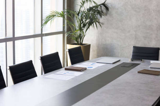 istock Modern business meeting room with large table, empty chairs 2179720731