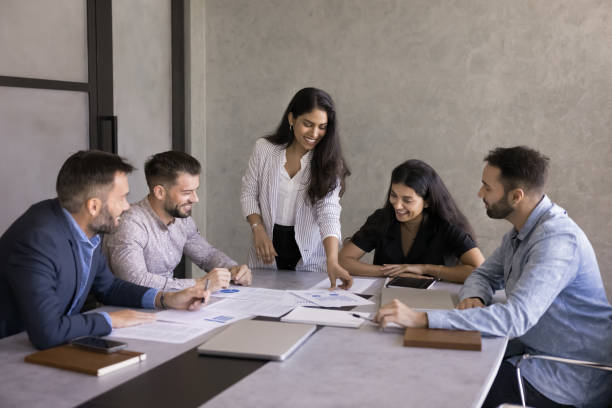istock Multiethnic business team of positive young colleagues analyzing marketing data 2179722024