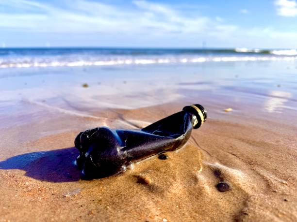 istock An empty plastic bottle polluting the coast of Northumberland 2179723301