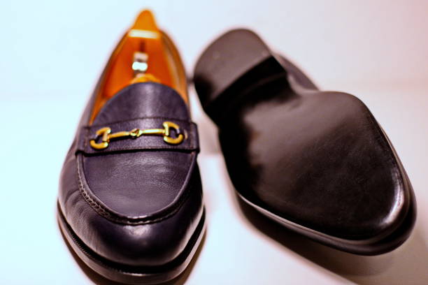 Collection of male fashionable leather shoes on black background