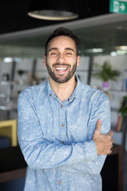 istock Cheerful positive handsome Hispanic entrepreneur man laughing at camera 2179727741