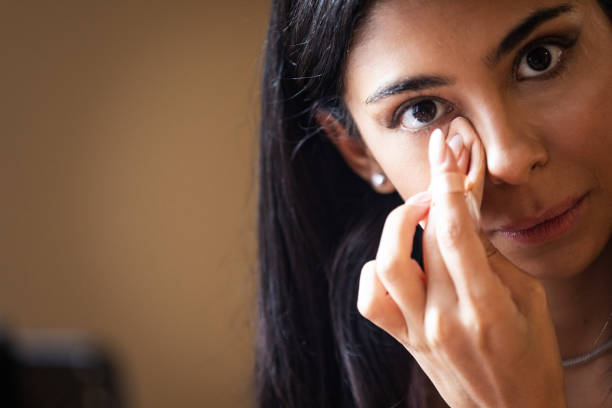 istock Beautiful woman is applying makeup and giving techniques to audience while live streaming. 2179728666