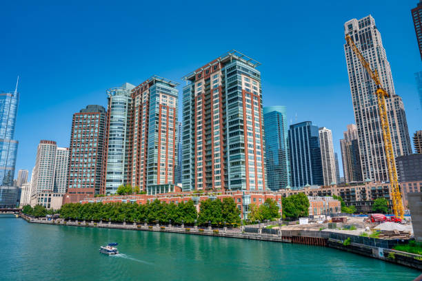 Chicago, IL - July 26, 2024: Modern skyscrapers along Chicago River on a beautiful summer morning.