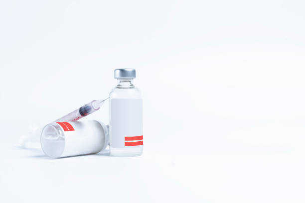 istock Vaccine vial bottle and syringe isolated on white background with copy space 2179729711