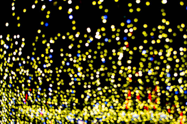 Blurry neon lights representing celebration of important event. Suitable for wallpaper or design background.