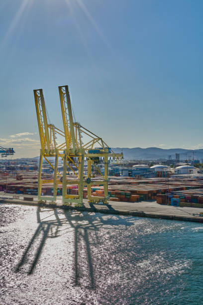 Barcelona. Espain -October 20,2024: Port of Barcelona with cranes for loading and unloading goods Ideal for issues related to logistics, industrial ports and global trade.