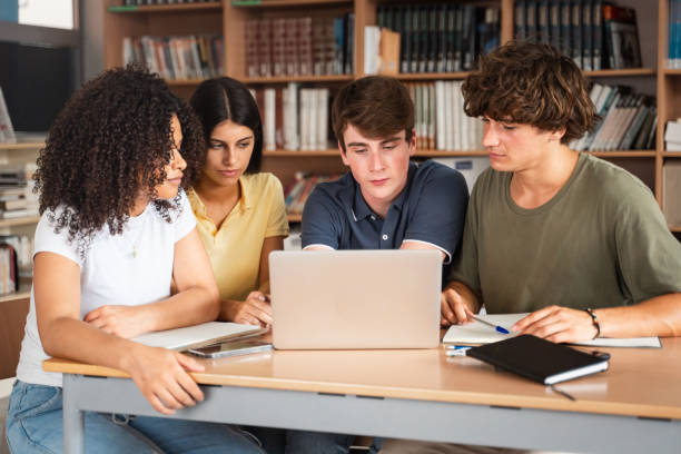 istock College student studying together with laptop at School library ready to start University 2179733662