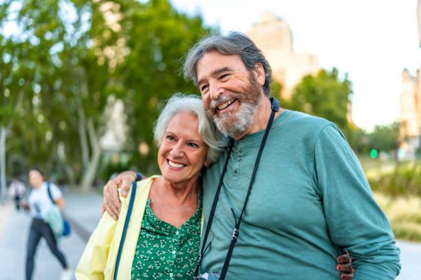 istock Senior couple embracing visiting a city on holidays 2179735670