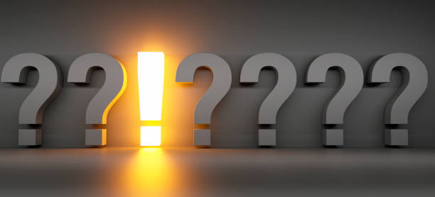 istock Row of black question mark symbols with luminous exclamation 2179736263