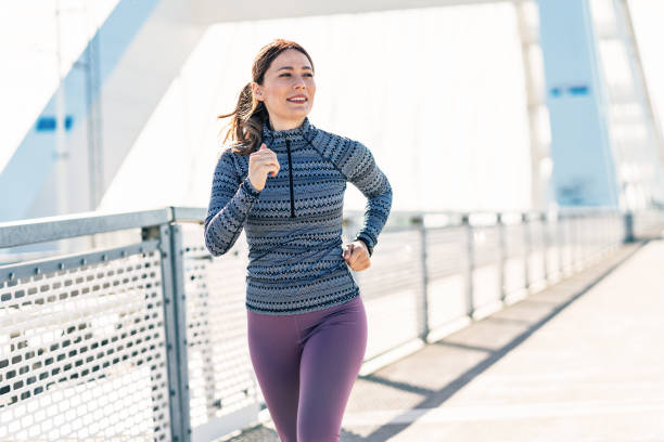 istock Happy sportswoman running 2179738895