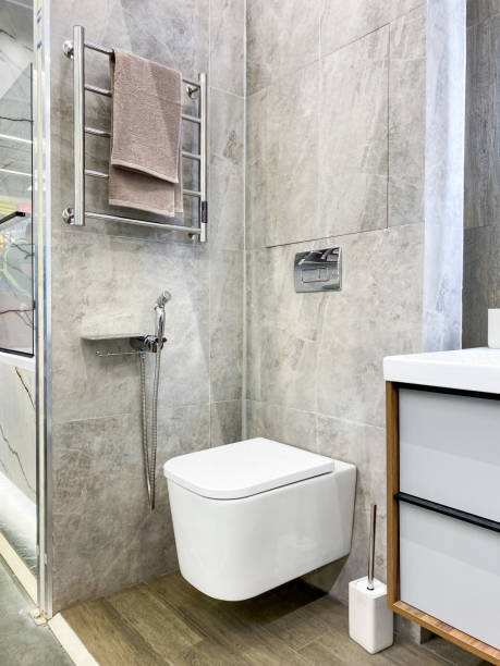 istock Explore a stunning modern bathroom design featuring a sleek wallmounted toilet alongside a stylish towel rack that embodies contemporary aesthetics and minimalism 2179739382