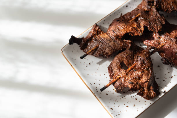 istock Anticuchos on a white plate, a taste of Peru. 2179740468