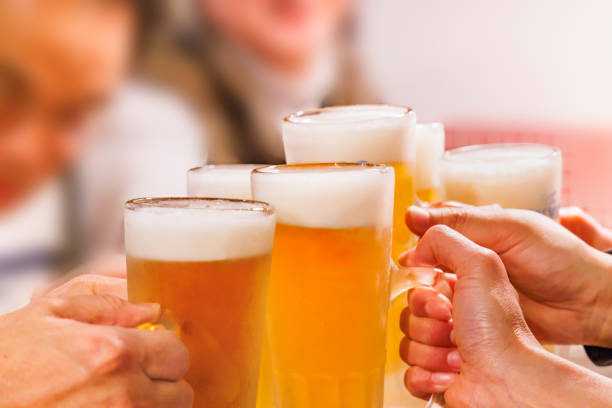 istock People toasting with ice-cold beer and sour drinks 2179740962