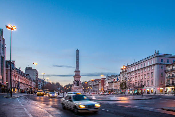 istock Traffic Flows Through Praca Dos Restauradores in Lisbon at Dusk 2179742410