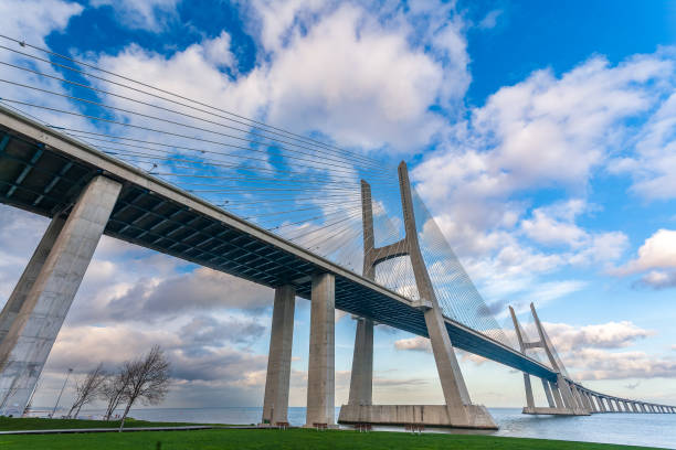 istock Vasco Da Gama Bridge Arches Over Lisbon's Tagus River 2179747487