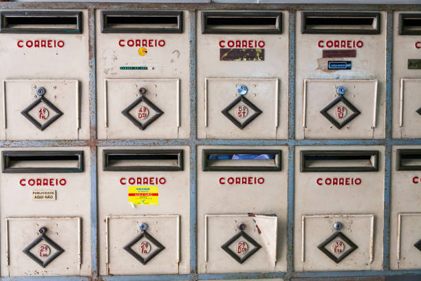 A row of vintage mailboxes in Bairro Alto, Lisbon, reflecting the city's unique urban architecture and history.