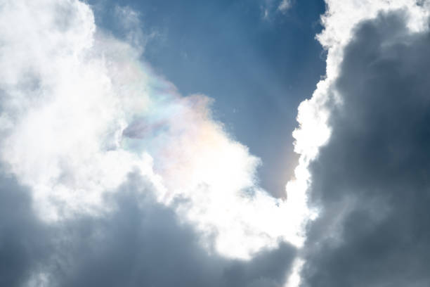 Reflection of sunlight spectrum on cumulonimbus clouds in rainy day,  natural light .