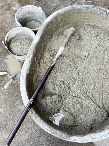 istock Mixing a cement in salver for applying construction. 2179750490
