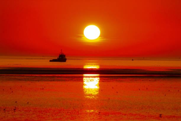 A beautiful sunset at the beach. This photo captures the last few moments of a beautiful summers day.
