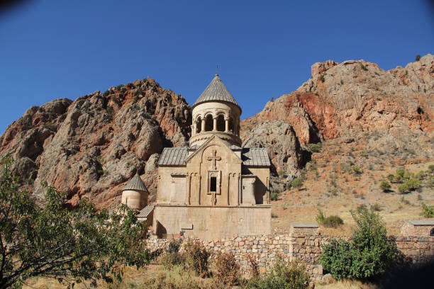 istock Ancient orthodox church building with a bell tower on a rocky mountainside 2179757891