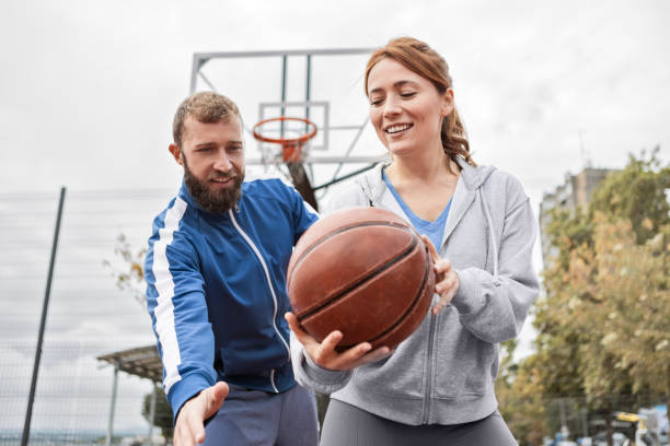 istock Young Couple Having Fun Playing Basketball 2179761917