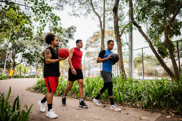 istock Basketball players walking and talking on the public park 2179763281