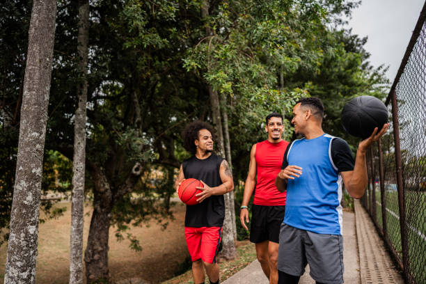 istock Basketball players walking and talking on the public park 2179763319