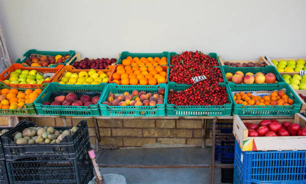 A street stall selling fresh fruit and potatoes in the Mangalem district of Berat in southern Albania. Including cherries, peaches, apricots, apples, plums and oranges. Berat is a major tourist centre, being UNESCO listed and famous for its Ottoman architecture