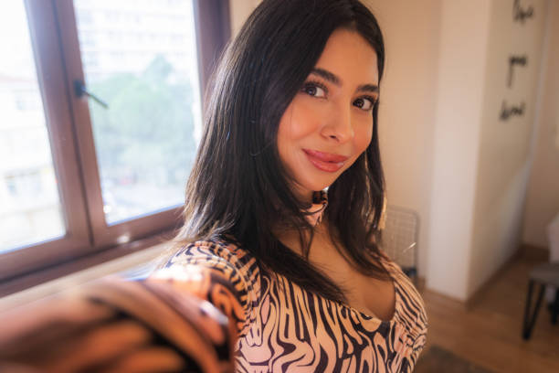 istock Young influencer woman is taking selfie after make-up video. 2179767250