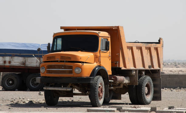 Yellow old excavation dump truck