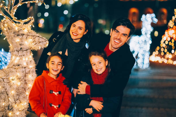 istock Family outside at Christmas night 2179770080