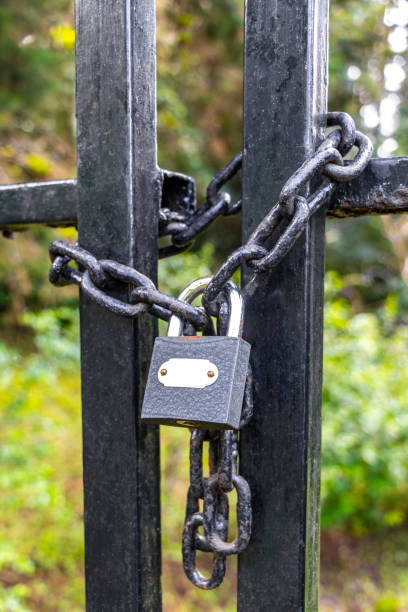 istock Nature locked up behind bars and gate with a lock. 2179775342